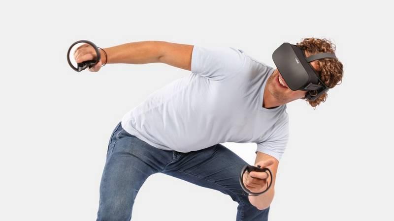 fit guy playing Oculus rift image description