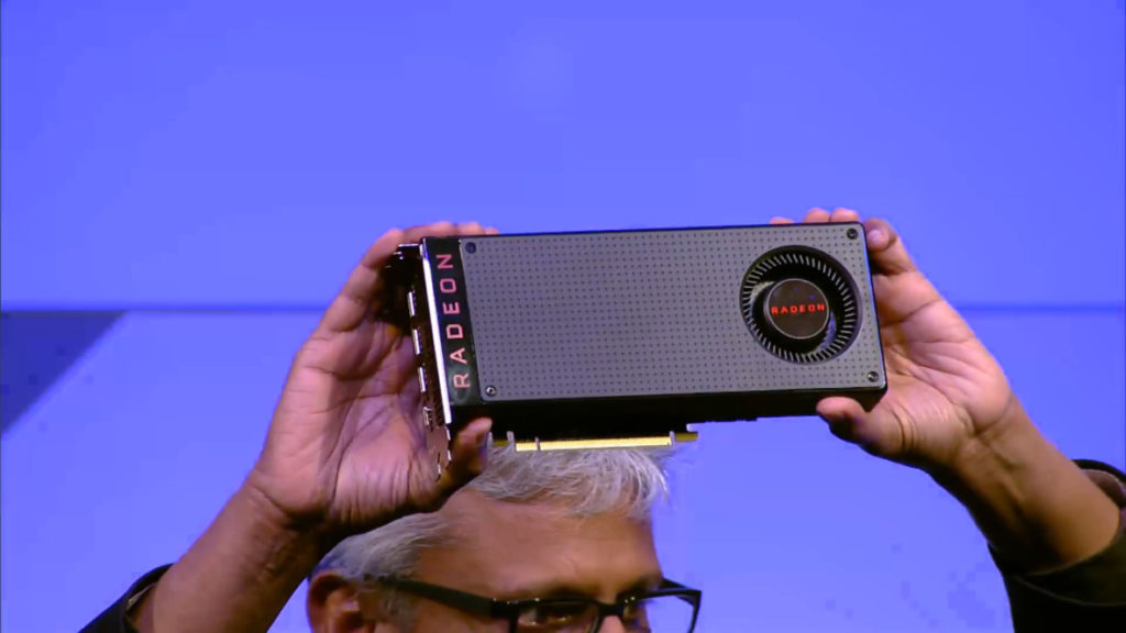 man holding AMD RX graphic card