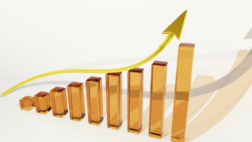 upward trending chart in gold and bronze