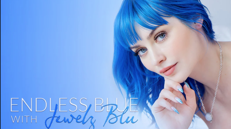 A woman with blue hair, blue eyes, and blue nails looks at the camera with the text endless blue on the image