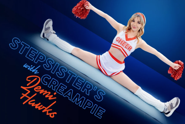 A Cheerleader is doing the splits with red pompoms in her hands