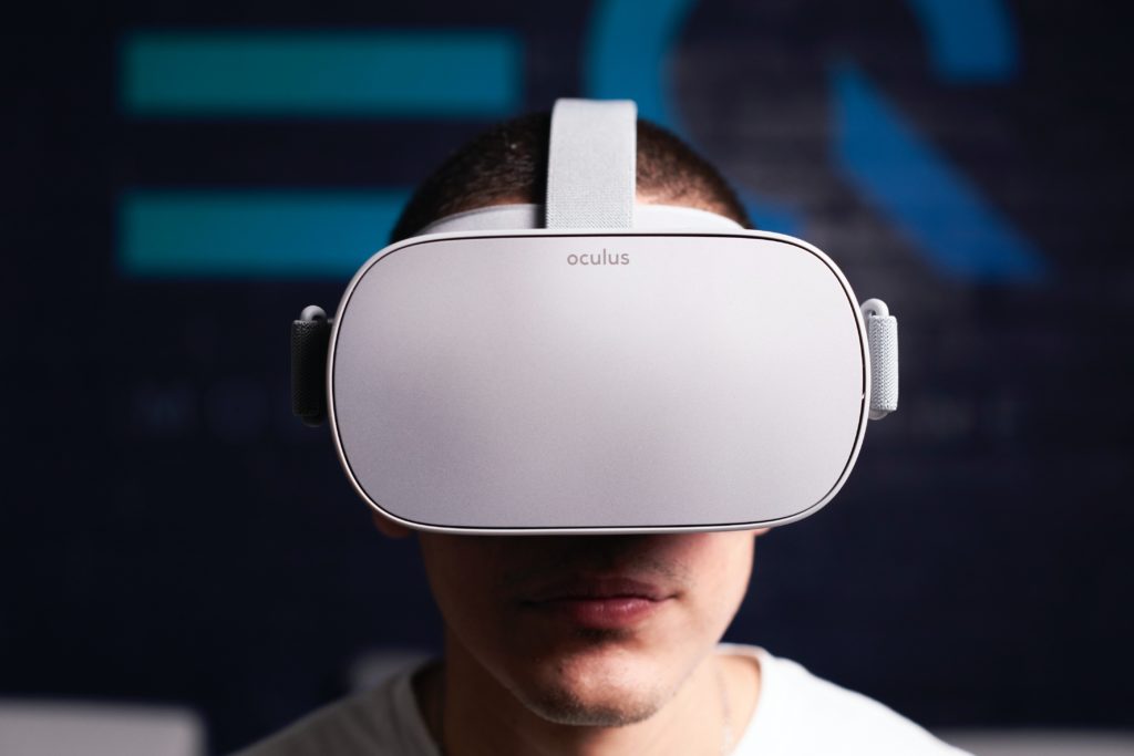 man wearing a white Oculus Quest headset