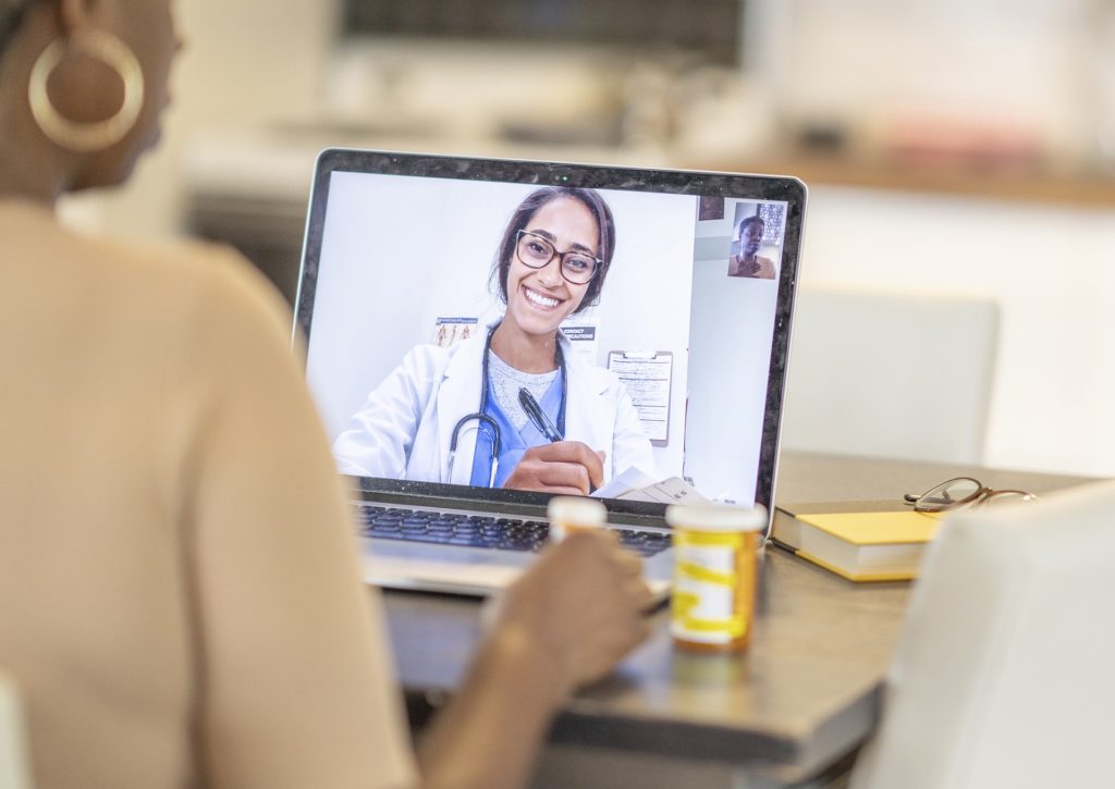woman talking to a doctor during online consultation