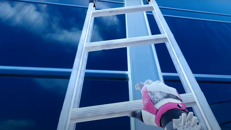 player climbing a steel ladder on city building