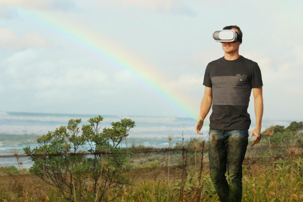 man wears white vr headgear outdoors