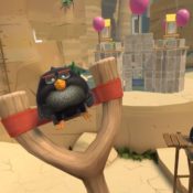 black angry bird on a slingshot
