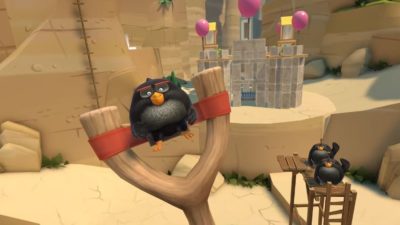 black angry bird on a slingshot