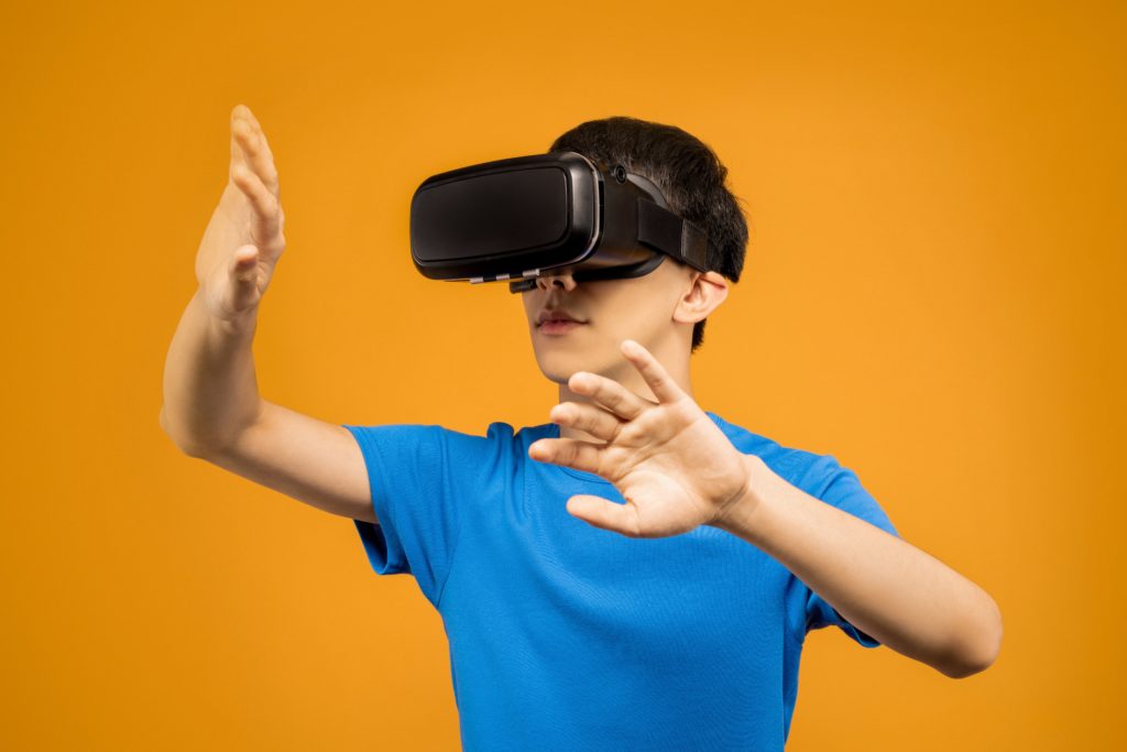 boy wearing black oculus quest headset