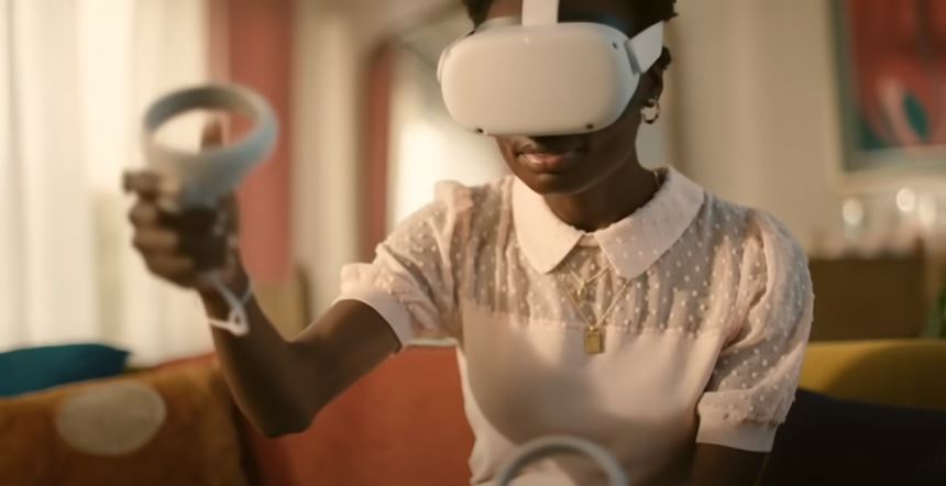 woman wearing oculus quest headset and holding controllers
