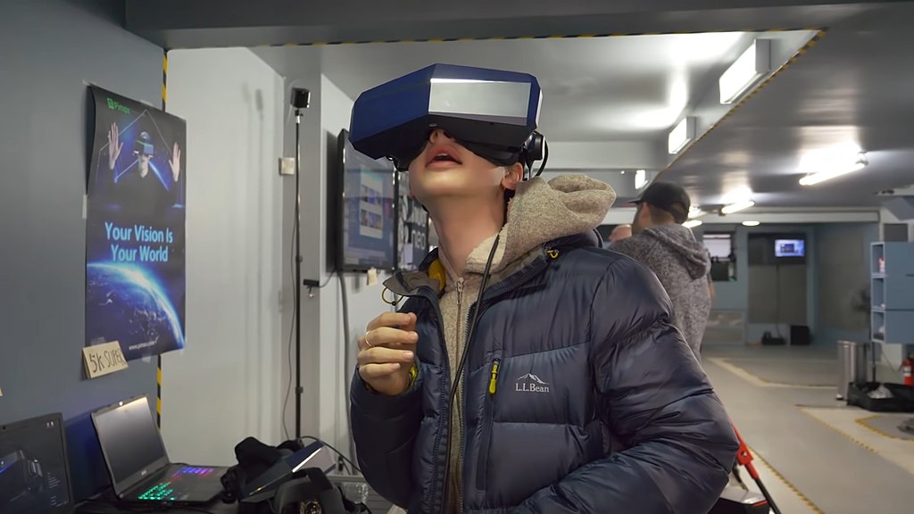 woman in an expo wearing a Pimax Vision 8K Xset