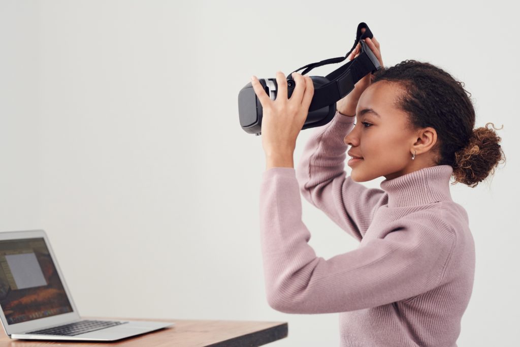 woman taking a break from using vr headset