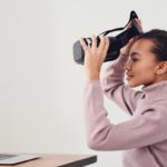 woman taking a break from using vr headset