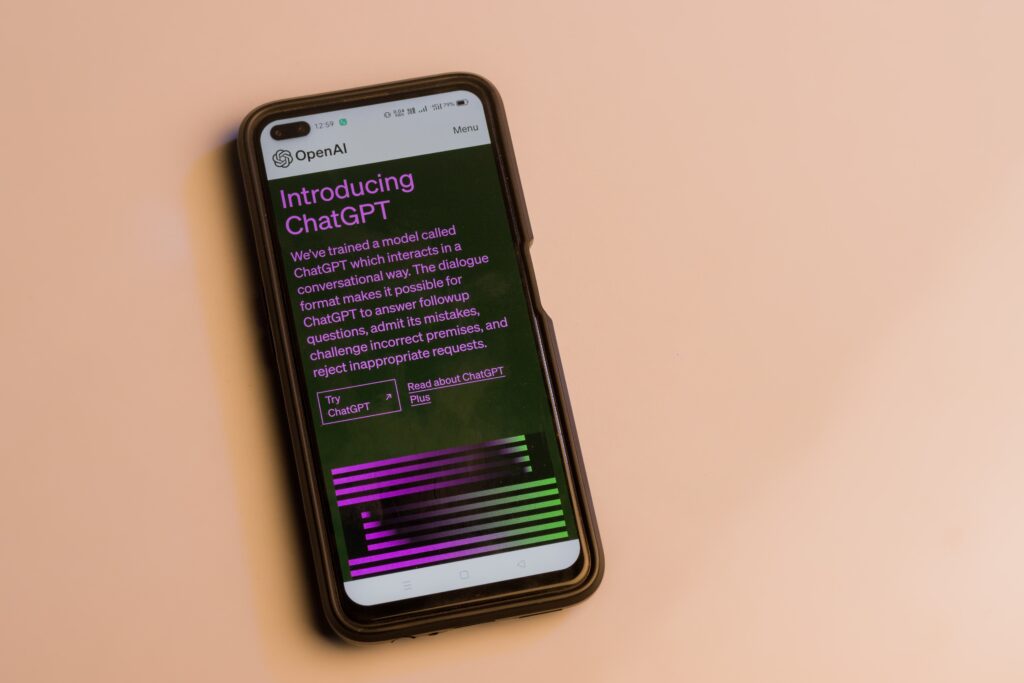 Webpage of ChatGPT, a prototype AI chatbot, is seen on the website of OpenAI, on a smartphone