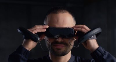 man wearing bigscreen beyond the world’s smallest headset