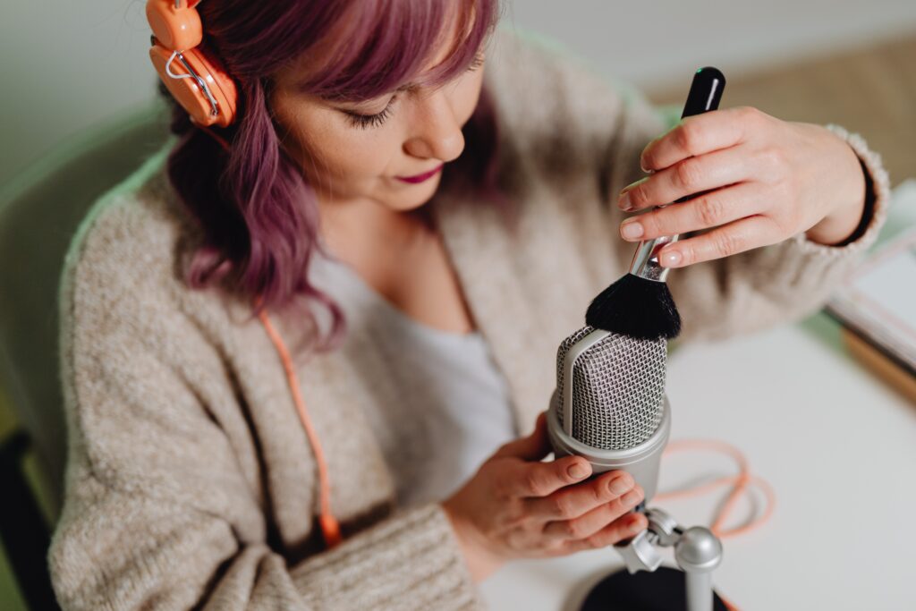 woman recording asmr using makeup brush