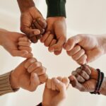 teens doing fist bump as a group