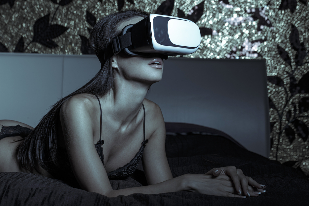 sexy woman in underwear using vr glass in bed in dark