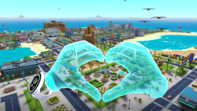 hands making a heart sign with aerial city view in little cities