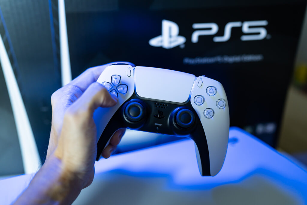 person holding a ps5 controller