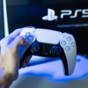 person holding a ps5 controller