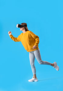 running young woman in vr glasses on blue background Full-Body Tracking in VR